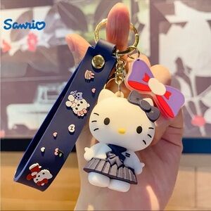 Sanrio Hello Kitty Keychain with Purple Bow and Navy Strap